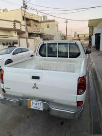 سياره مستبوشي موديل 2010سياره نضيف فقط بيها قطعتين صبغ اثر جرد السياره...