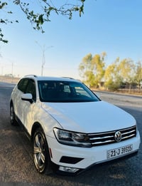 تیگوان مۆدیل ٢٠٢١ فول موسەفات  سپی بەفری  چوار پاچەی بۆیاخ ە بئ ناوگرت...