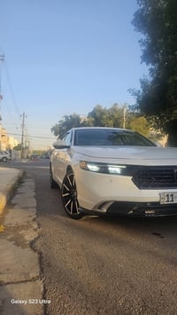 للبيع هوندا اكورد 2023تورنك هايبرد اعلى فئه رقم بغداد  سياره باأسمي اق...