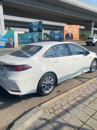 كورلا هايبرد موديل 2023 رقم بغداد مكفوله من شخط سياره كفاله عامه ماشيه...