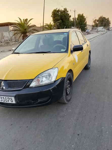 يا الله لانسر موديل 2010رقم بغداد هزه وسنويه وهيه ورقم كله جديد تحويل ثاني يوم بيه صبغ حزام بدون ضربه لغد شاصي مكفول مكينه وكير وصدر وتبريد كله جديد مكاني بغداد سعر 60 بيه مجال *********** كلشي واضح بصور
