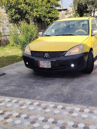 لانسر ٢٠١٠ • محرك جديد • رقم ديالى