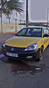 للبيع لانسر بومه2010 مكينه 2000 تايرات خط ابيض تخم جديد صدر جديد مكينه...