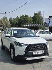 جميعآ  عندي كورلا كروز رقم بغداد بأسمي موديل 2025 ماشيه عشرة الالف ونص...