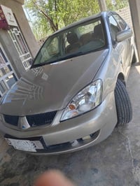 لانسر ٢٠١٠ • نظيف • رقم ديالى