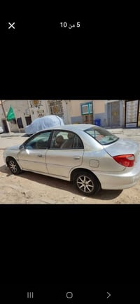 ريو 2001 بدون ضربه حداديه تخم تاير باتري كله جديد كير ومحرك جديد حاويه...