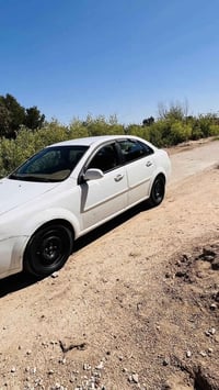 اوبترا ٢٠١١ للبيع سياره مرتبه بيها  ربع جاملخ صبغ  وتقريبا شبر بالباب ...