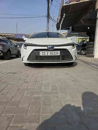 كورلا هايبرد  موديل 24 ماشيه 20 حادثه الباب الصدر وجاملغ شويه بي بعده ...