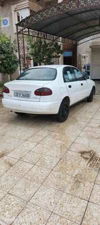 دايو لانوس ٢٠٠١ رقم سنويه فحص كلها جديد كيرك محرك تبريد شرط  سعر 36  و...