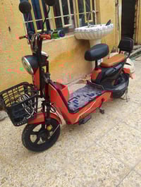 دراجة شحن حجم 14نضيفة حيل كلة شغاله بس بطاريات نص عمر اشاير ليت كلة شغ...