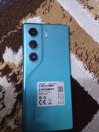 جهاز Tecno Camon بحالة ممتازة، لون أزرق مميز. يستخدم كاميرا ثلاثية لأد...