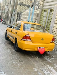 نيسان سني بدي كوري موديل 2009 السياره بسمي مصفره هيه وغرمات رقم انكليز...