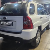 سبورتج 2009 خليجي لون ابيض رقم اربيل سنويه جديده رقم جديد  سياره جديده...