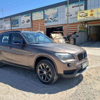 Bmw x1 2013  محرك كاز سوبر  محرك ٤ سلندر  صبغ ٣ قطع فقط ابيع حزام  تخم...