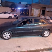 اوبل بزون موديل 95السياره محرك وكير شرط تايرات جدد السياره كلها بلاديه...