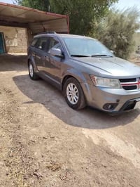 دوج جورني موديل 2013 محرك سته رقم بغداد بسمي سعر 125،وبيه مجال