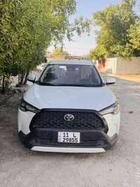 كورلا كروس هايبرد 2024 محرك 2000 ماشية 38 الف مكفولة رقم بغداد بأسمي د...
