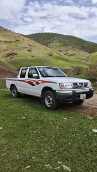یەناوی خوای گەورە. ئەم سەیارە مان. بۆ فرۆشتن.  نیسان دەبڵ 2002بۆفرۆشتن...