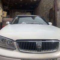 نيسان سني ياباني القبق الاسود مديل ٢٠٠٢الون ابيض رقم الجديد باسمي مصبو...