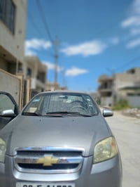 سيارة افيو موديل 2008 بيها طخه بسيطة الباب الي يم السايق والتكمه كير ت...
