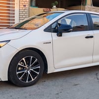 كورلا هايبرد شكل امريكي 24 فول مواصفات داخل احمر رقم بغداد  ماشيه 40 ا...