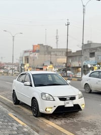 � للبيع كيا ريو 2012 أبيض – ماشيه 125 ألف ✅ كيرمكينة شرط ✅ طخم شرط ✅ ت...