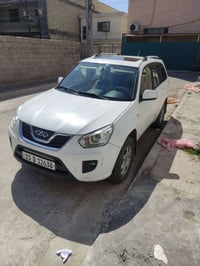 شيري تيگو 2014 محرك 2000 گير ميكانيكي المرغوب لون ابيض رقم بغداد انكلي...