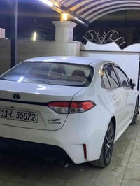 كورلا هايبرد 2024 تجميع صين شكل امريكي علامه زركة داخل جلد احمر مكفوله...