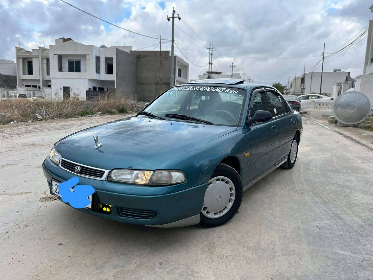 مازدا فاسۆلیا مودێل 1992رەنگی سەوز گێڕ مەکینە تەبرید گەرمی بەشەرت چوار تایەی تازە تاخم پێشی تازە سەنەوی تازە  دەفتەر بەنزین سعری 54وەرەقە رقم تەلەفۆن ///***********///*********** كركوك, العراق
