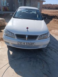 سني موديل 2002كير عادي كير ومحرك مكفولات من كل شي رقم بغداد انكليزي لو...