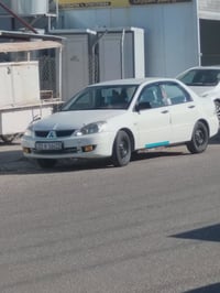 لانسر ٢٠٠٨ • مصبوغه • بدون حادث
