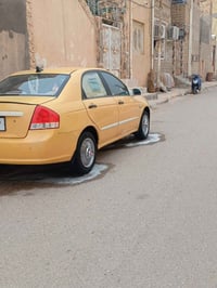 سياره كيه سيراتو 2009 خليجي  بيه تبديل جاملغ  تبريد شغال حداديه ومكينه...