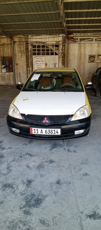 لانسر موديل 2010 رقم بغداد مصفره هيئه وغرامات جاهزه تبريد تدفئه كله فو...