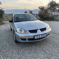 لانسر • ٢٠٠٧ • باسمنا