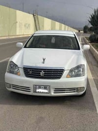 ٢٠٠٦ • أبيض صدف • مقاعد جلد