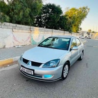 لانسر ٢٠١٠ • محرك ١٦٠٠ • رقم ديالى