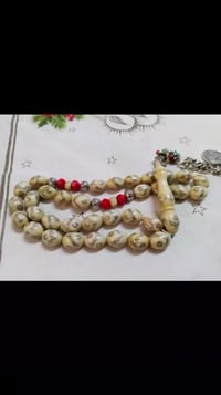 عاج ناب • عظم جمل • مطعمة فضة