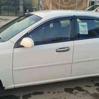 اوبتره للبيع موديل 2010 رقم مميز بيه قطعتين السيارة حلوة وجاهزه والرقم...