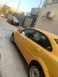 اوبتره ٢٠١٠  لون اصفر تكسي كير عادي  رقم بصره احمر  محرك كير وراعي  ال...