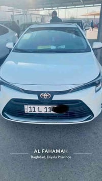 كورلا هايبرد موديل 2025 ماشيه ١١ الف جديده مرقم بغداد ورقم ممييز بيها ...