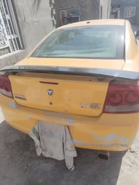 جارجر ٢٠٠٩.اصل رقم ذي قار. كير ومحرك كفاله السياره جاهزه للعمل وكشر.. ...