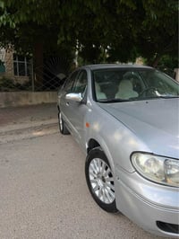 nissan 2002 بۆ فرۆشتن  مۆدیلی ٢٠٠٢  چوار جام. کارەبا ئاوێنە کارەبا مەک...