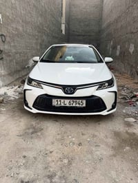 كورلا هايبرد موديل 2023 ماشيه 53كم محرك 1.8 بأسمي بغداد داخل مميز لوني...