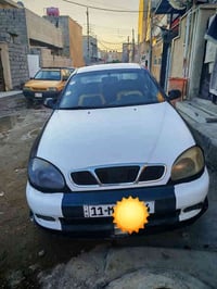 ا لسلام عليكم دايو لانوس 2001 اوتماتيك كير ومحرك كورلة رقم بغداد جديد ...