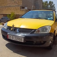 شباب لانسر رقم بغداد انكليزي باسمي موديل ٢٠١٠ مصفره من كلشي محرك ٢٠٠٠ ...