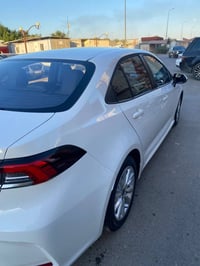 كورلا 2025  شكل الخليجي محرك 1800 هايبرد HEV  داخل اسود رقم بغداد ماشي...