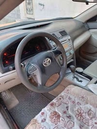 كامري ,,2009. وارد امريكي ضرر بسيط تحت البك لايت السائق باسمي تحويل فو...