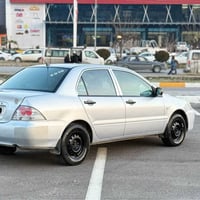 لانسر ٢٠١٠ • بدون بوية • ميكانيك مضبوط