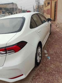 كورلا هايبرد وارد صيني موديل 2025 ماشيه 18الف كفاله عامه رقم بصره 150و...