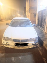 عندي سياره نيسان سني ياباني موديل 2000 سيارة بسمي  رقم انكليزي بغداد س...